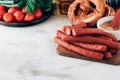 Oktoberfest food, appetizing beer snacks set for big company.Grilled sausages, chips, pretzel,crackers on white table.Toned image. Royalty Free Stock Photo