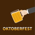 Oktoberfest Hand and clink beer glasses mug with foam cap froth bubble. Brown background Flat design