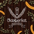 Oktoberfest lettering with wreath leafs in wooden background