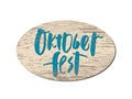 Vector illustration of Oktoberfest handwritten lettering on wood. Royalty Free Stock Photo