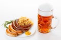 Oktoberfest menu, beer mug, a plate of sausages and sauerkraut Royalty Free Stock Photo