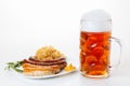 Oktoberfest menu, beer mug, a plate of sausages and sauerkraut Royalty Free Stock Photo
