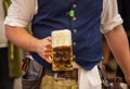 Oktoberfest, Munich, Germany. Waiter serving beer, closeup view Royalty Free Stock Photo