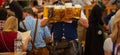 Oktoberfest, Munich, Germany. Waiter serving beers, closeup view