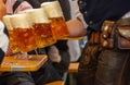 Oktoberfest, Munich, Germany. Waiter serving beers, closeup view Royalty Free Stock Photo