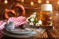 Oktoberfest place setting with beer and salt pretzel Royalty Free Stock Photo
