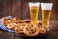 Oktoberfest salted soft pretzels in a bowl and beer