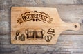 Oktoberfest sign with various hand drawn symbols, cutting board