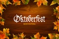 Oktoberfest vintage frame with beer and autumn leafs on the wood background . Poster template. Vector illustration, EPS 10. Royalty Free Stock Photo