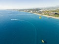 Okurcalar, Alanya, Turkey. Drone view of the wide blue Mediterranean sea with jet skis and boats near the shore, sunny Royalty Free Stock Photo