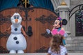 Olaf and Minnie in Mickeys Royal Friendship Faire on Cinderella Castle in Magic Kingdom at Walt Disney World Resort. Royalty Free Stock Photo