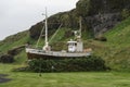 Olafsvik, Iceland - July 2, 2023 23: Old oak wooden boat shipwreck Tindur on dry land