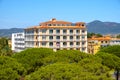 Olbia, Italy - Panoramic view of Olbia port area and Grand Hotel President with Cabu Abbas hills in background