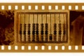 Old 35mm frame photo with vintage abacus Royalty Free Stock Photo