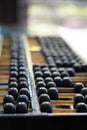 Old abacus and hold electronic calculator. picture financial concept design. Royalty Free Stock Photo