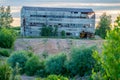 Old abandon factory building exterior in nature on a hill Royalty Free Stock Photo