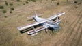 Old abandoned airplane on the field. Top view