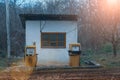 An old abandoned analog fuel station. Industrial zone or production area conquered by nature