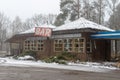 An old abandoned bar on a busy road. Ruin of restaurants in Central Europe Royalty Free Stock Photo