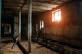 The old abandoned barn with the remains of feeders