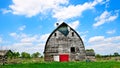 An old abandoned barn sits decaying on an empty farm Royalty Free Stock Photo