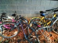 Old abandoned bicycles against wall in wuhan city