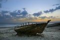 Old abandoned boat on the beach at sunset Royalty Free Stock Photo
