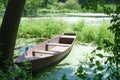 An old abandoned boat on the pond. Beautiful scenic landscape on the Tyasmin river, Kamyanka, Ukraine. Travel by Ukraine Royalty Free Stock Photo