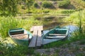 An old abandoned boat on the pond. Beautiful scenic landscape on the Tyasmin river, Kamyanka, Ukraine. Travel by Ukraine Royalty Free Stock Photo