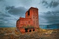 Old abandoned brick building on the background of a rainy autumn sky Royalty Free Stock Photo