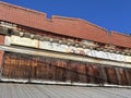 Old abandoned brick building rusted metal clear blue sky
