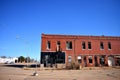 Old Abandoned Brick Building on a Small Town Main Street Royalty Free Stock Photo