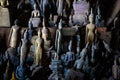 Old abandoned Buddha statues covered with dust and spider web at Pak Ou caves in Luang Prabang, Laos