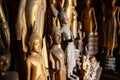 Old abandoned Buddha statues covered with dust at Wat Xieng Thong temple. Luang Prabang, Laos Royalty Free Stock Photo