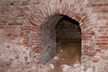 Old abandoned building brick wall arch weathered, derelict fortress catacomb dangerous adventure Royalty Free Stock Photo