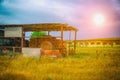 Old abandoned building. Canopy for hay storage and Exterior of an abandoned barn Royalty Free Stock Photo