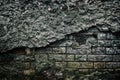 Old abandoned building dark gloomy brick wall with fallen off pl Royalty Free Stock Photo