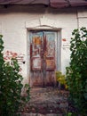 an old, abandoned building, locked wooden doors Royalty Free Stock Photo