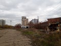 Old abandoned buildings with graffiti on walls. Urban ghetto.