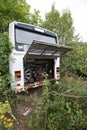 An old and abandoned bus standing in bushes Royalty Free Stock Photo