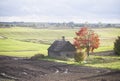 Old cabin in the autumn field, lithuania Royalty Free Stock Photo