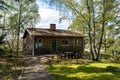 Old abandoned cabin house in the woods. Dacha guest house. Nobody lives there. The old wooden building fell into disrepair. Dirty Royalty Free Stock Photo