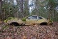 Old, Abandoned Car Covered In Moss In The Woods Royalty Free Stock Photo