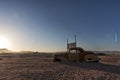 Old and abandoned car in the desert of Namibia. Solitaire. With the beautiful light of the sunrise.