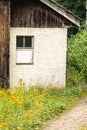 Old abandoned chalet building, overrun by vegetation, Switzerland Royalty Free Stock Photo