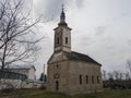 An old abandoned church building in a dilapidated condition against a gloomy sky during the cloudy day