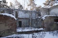 old abandoned crumbling brick house in winter woods Royalty Free Stock Photo