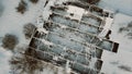 old abandoned country house in winter forest, aerial view made with drone Royalty Free Stock Photo