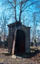 Old abandoned crypt with brocken door