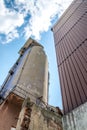 Old abandoned dirty comunism silo for sand and silicon during demolition Royalty Free Stock Photo